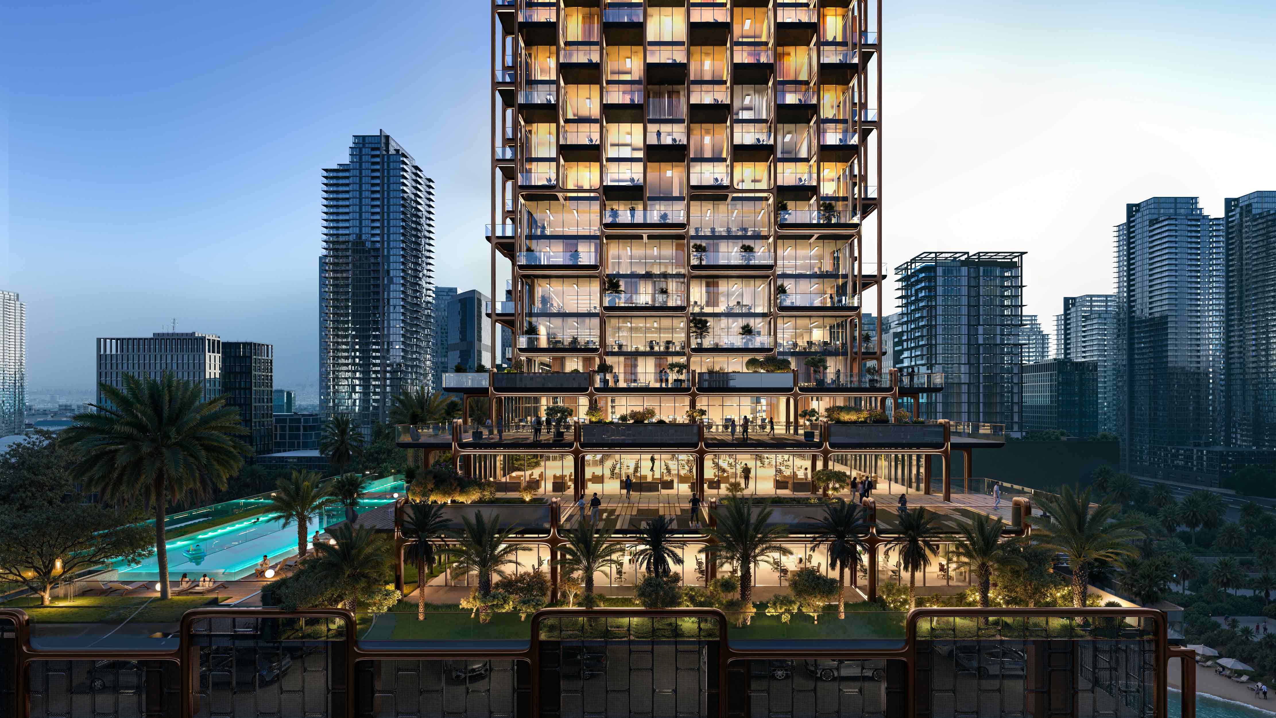 The Symphony By Imtiaz A modern multi-story building with glass facades, palm trees, and a pool, surrounded by city skyscrapers.